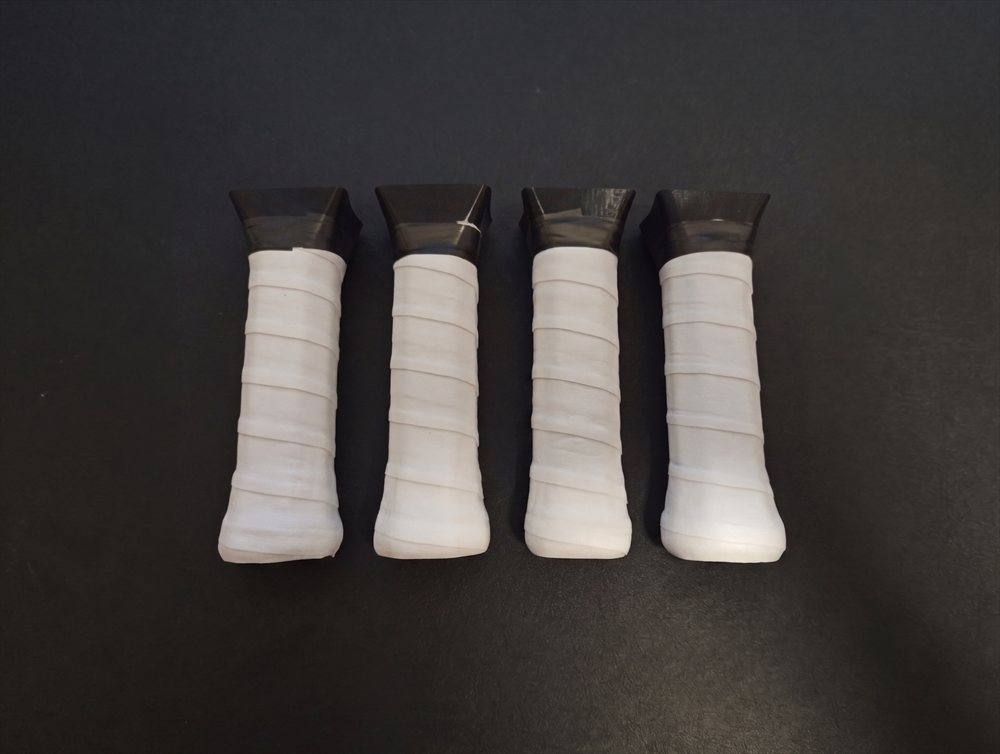 The four T0 Hex handle fits — real wrapped handles standing in a row.