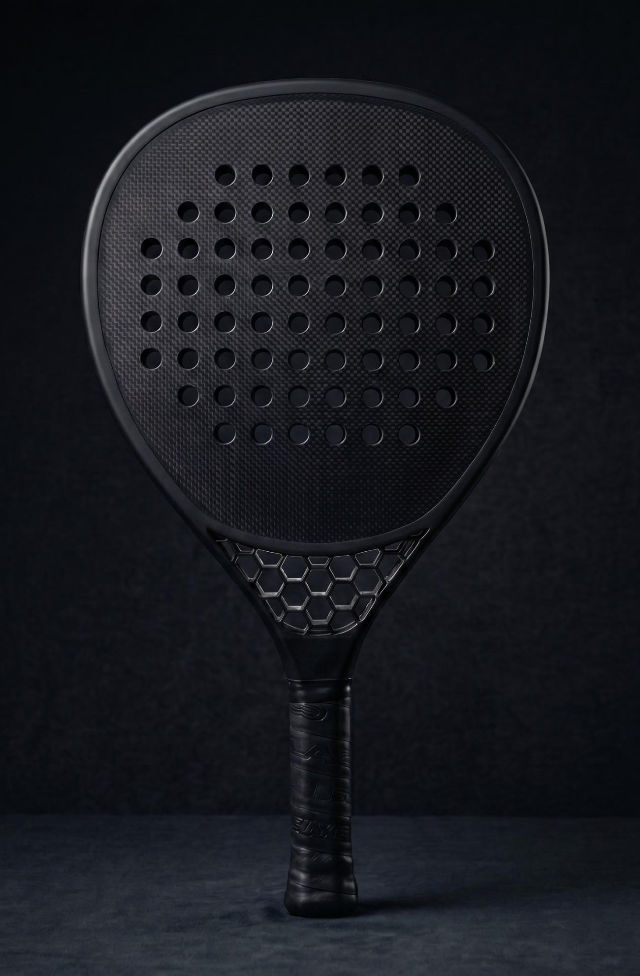 T0 Hex padel racket — near-black studio